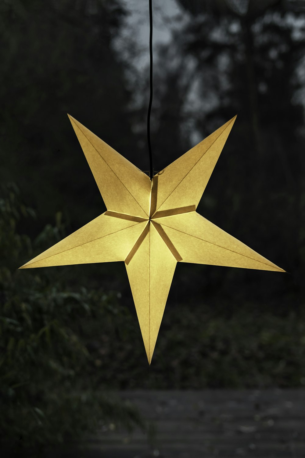 yellow star hanging decor with light
