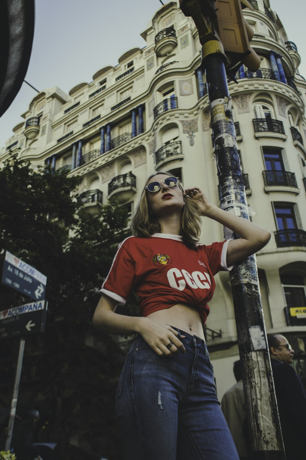 woman taking a pose near building