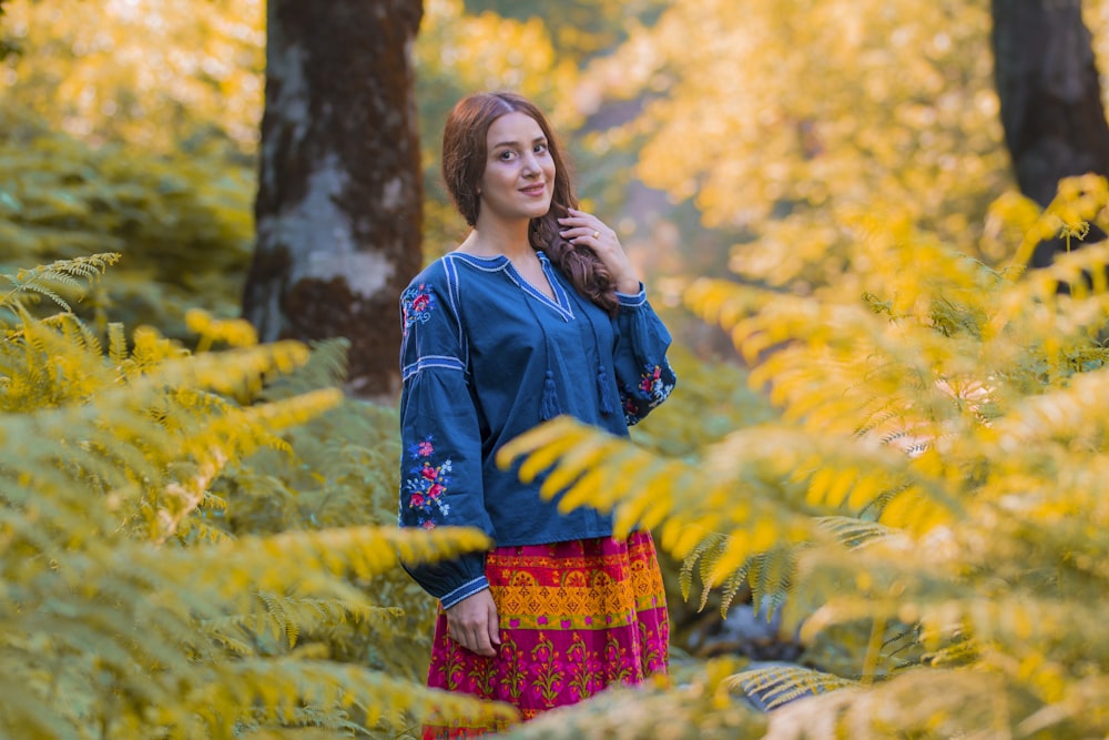 woman standing in forest