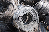 Rows of finished electrical wire coils neatly stacked and labeled for shipment.