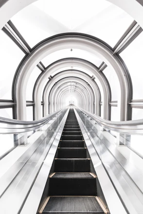 A sleek pneumatic tube system delivering groceries swiftly inside a modern gated society.