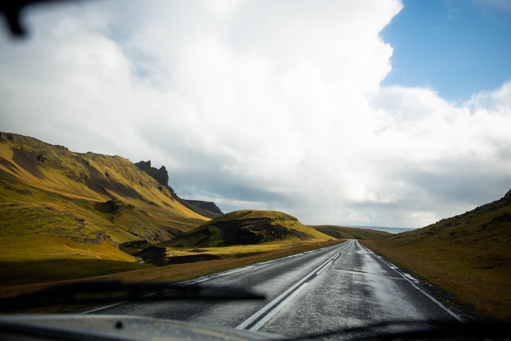 white clouds above road