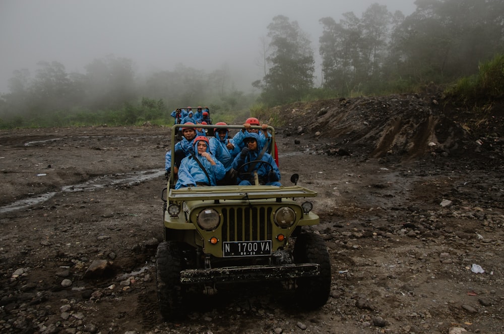 people riding off-road vehicle