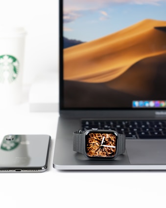 space gray MacBook and iPhone 6