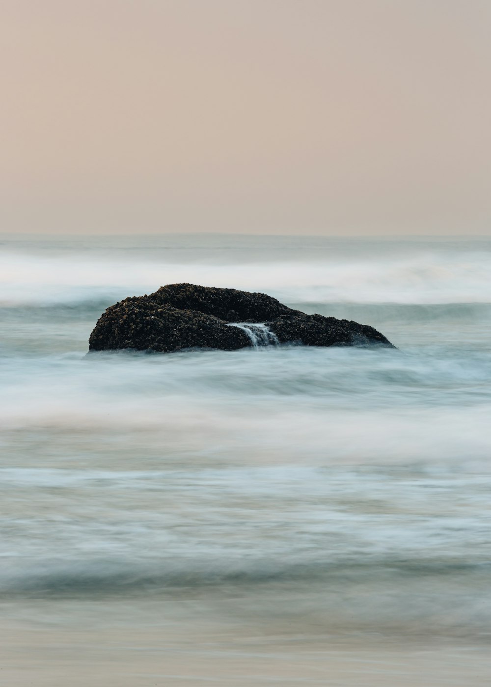 rock formation on body of water