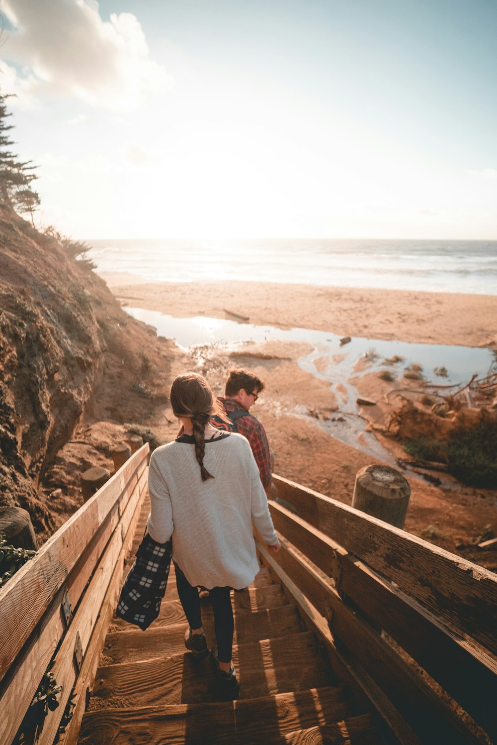 man and woman walking down on stairs