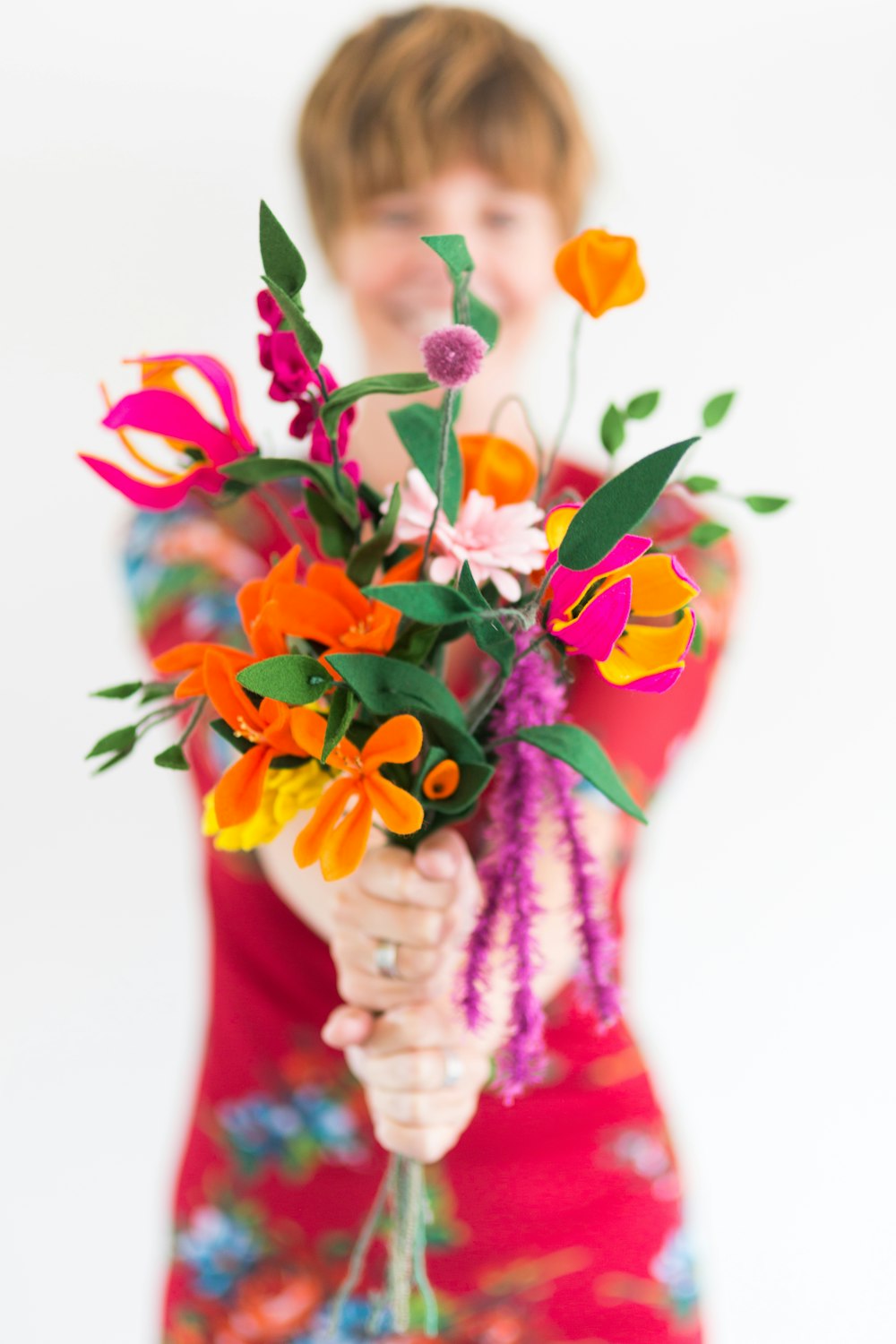 person holding bouquet of flowers