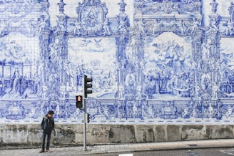 man standing near traffic lights