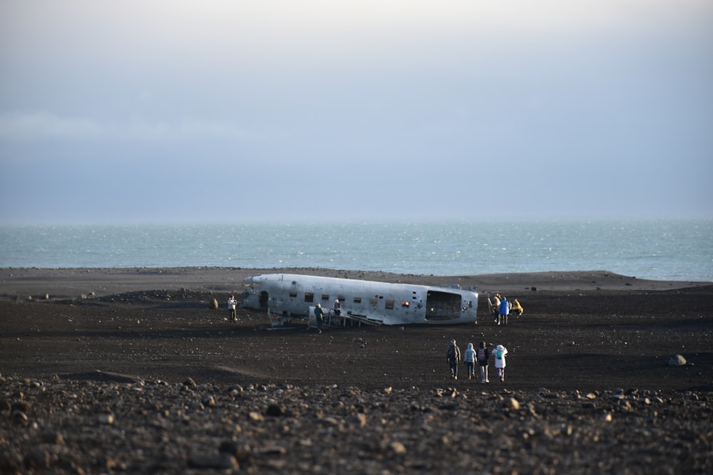 wrecked plane on black sand
