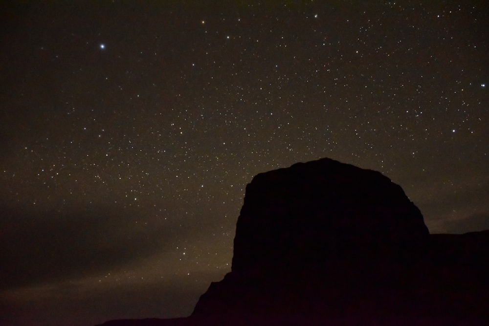 rock formation silhouette during nighttime