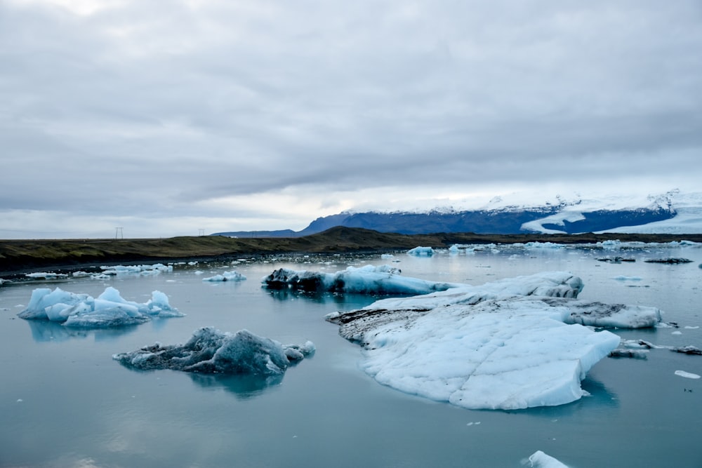 body of water with ice break during daytime