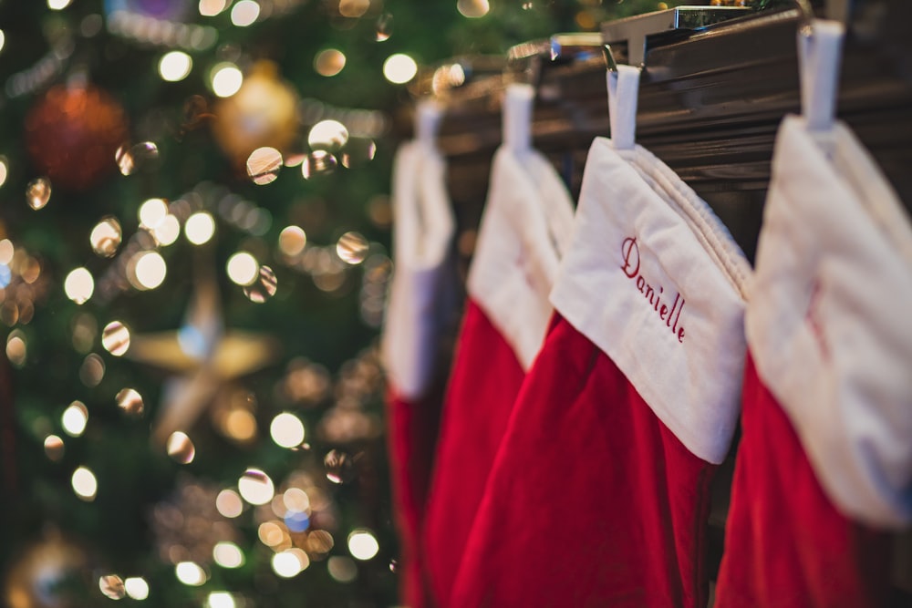 four red-and-white Christmas stockings