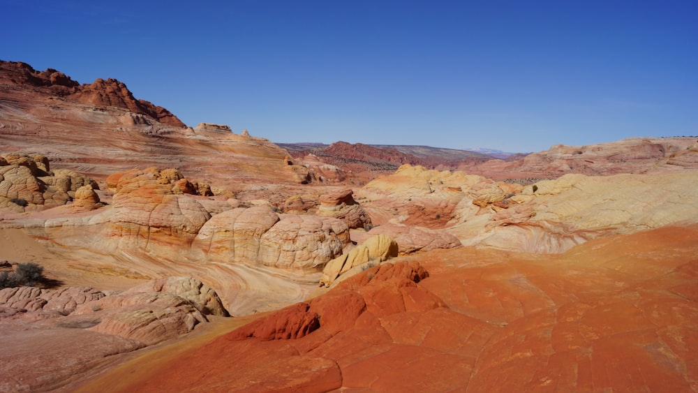 brown rock formations under blue sky