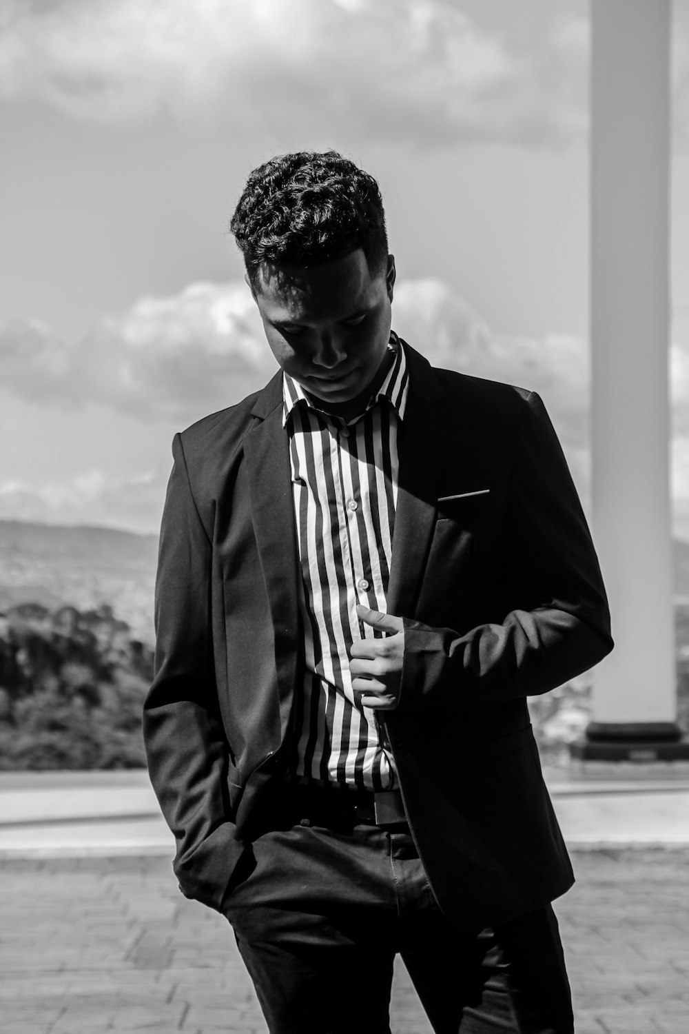greyscale photo of man wearing tuxedo