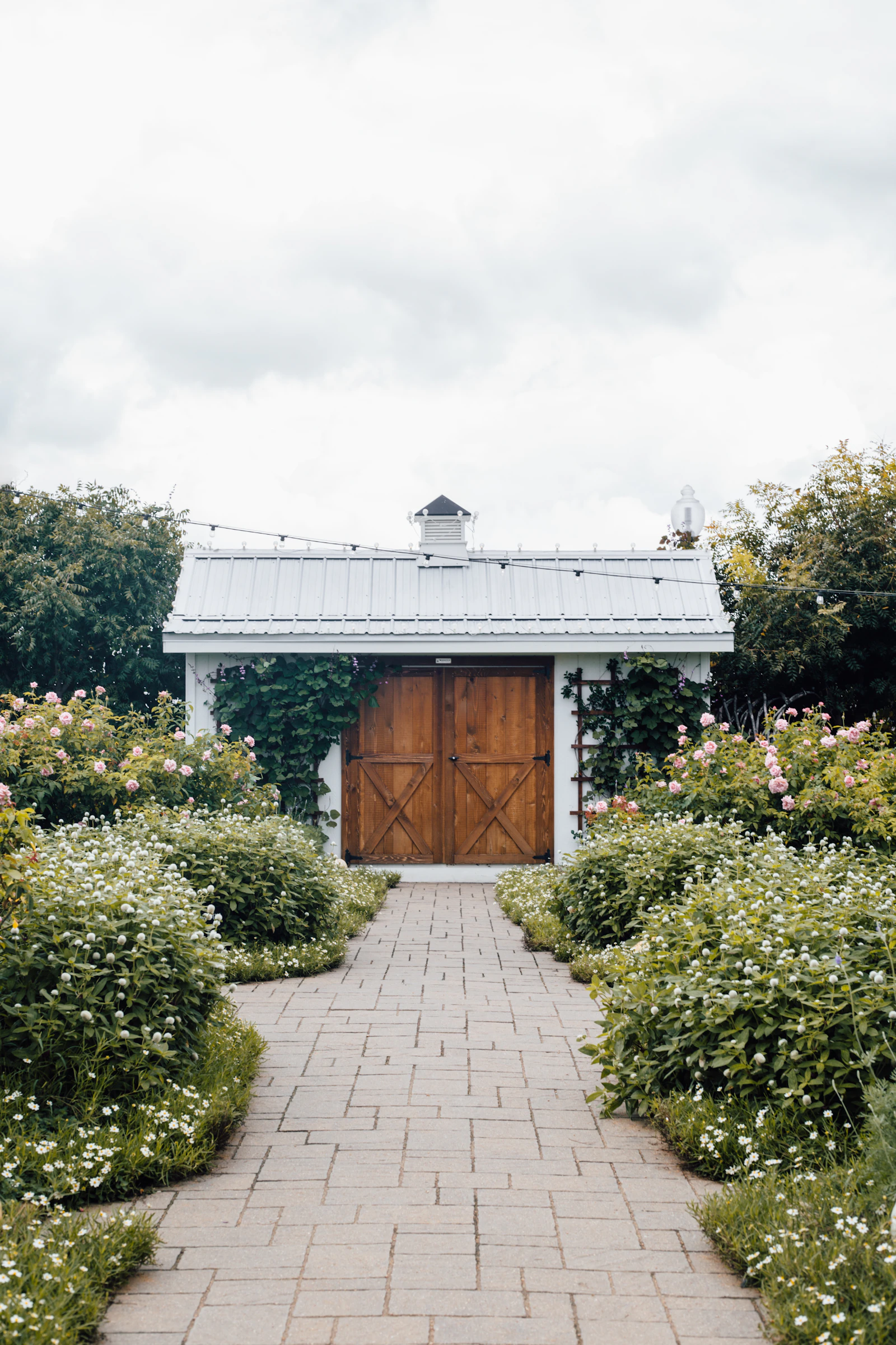 Rustic wooden farmhouse door under a cloudy sky