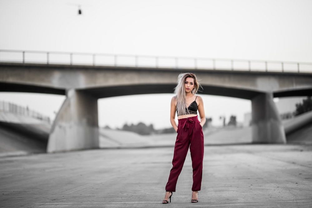 woman standing near bridge