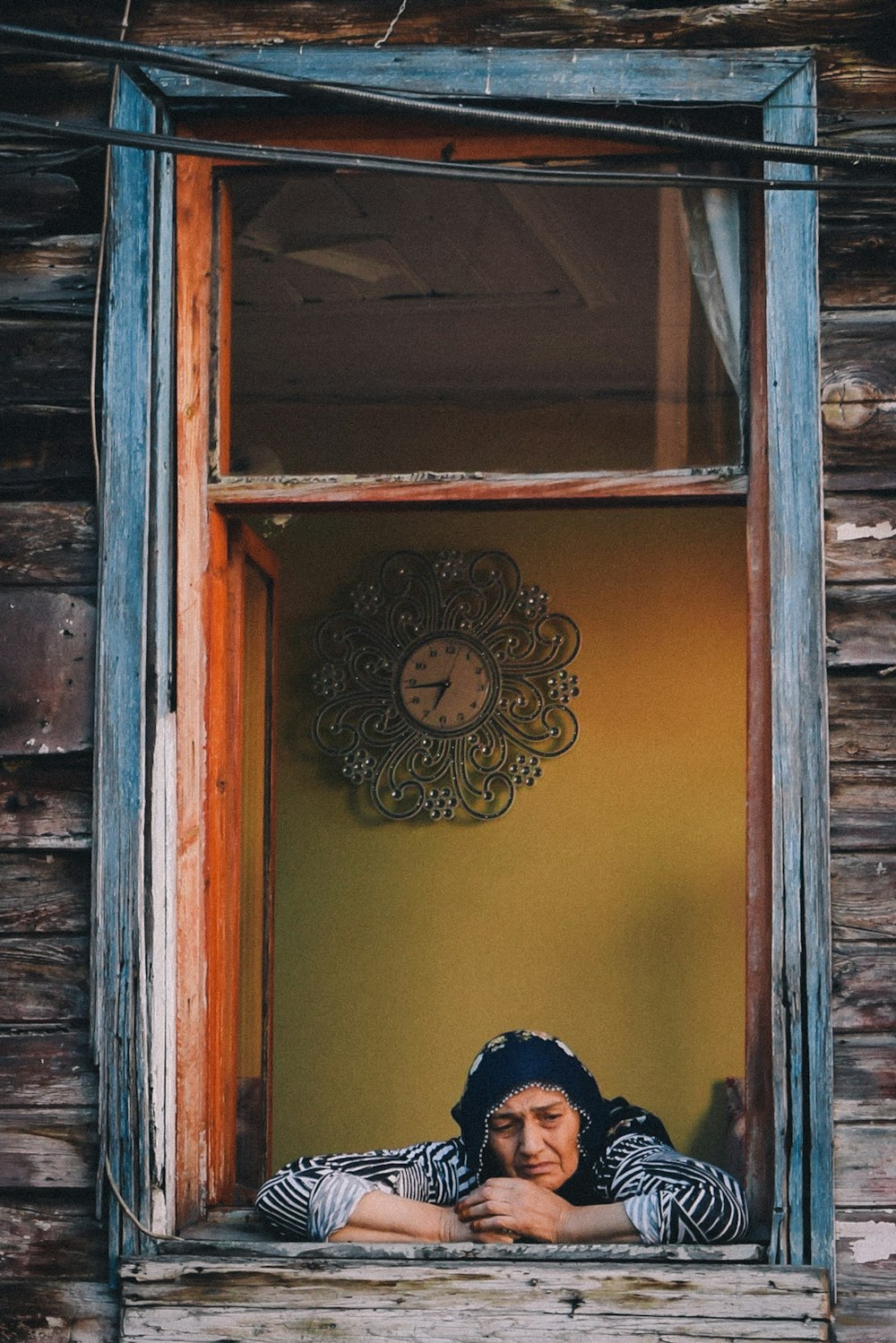 woman leaning on window