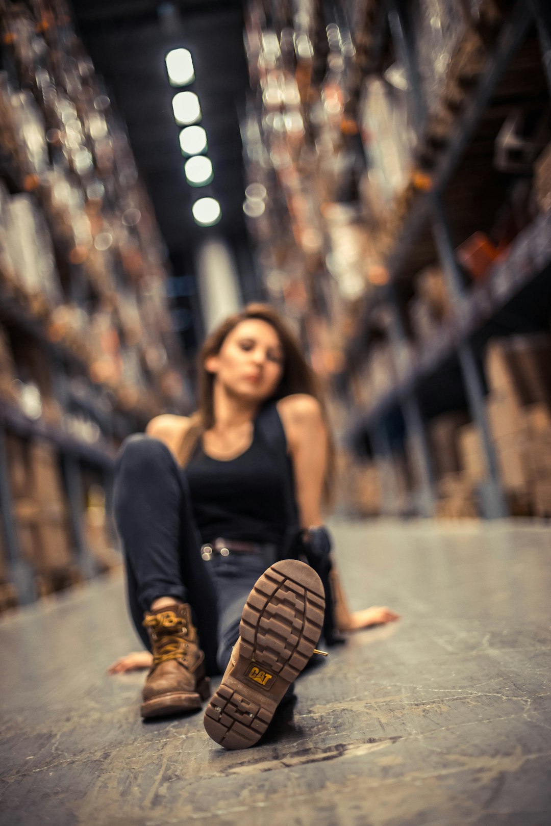 woman sitting on concrete floor