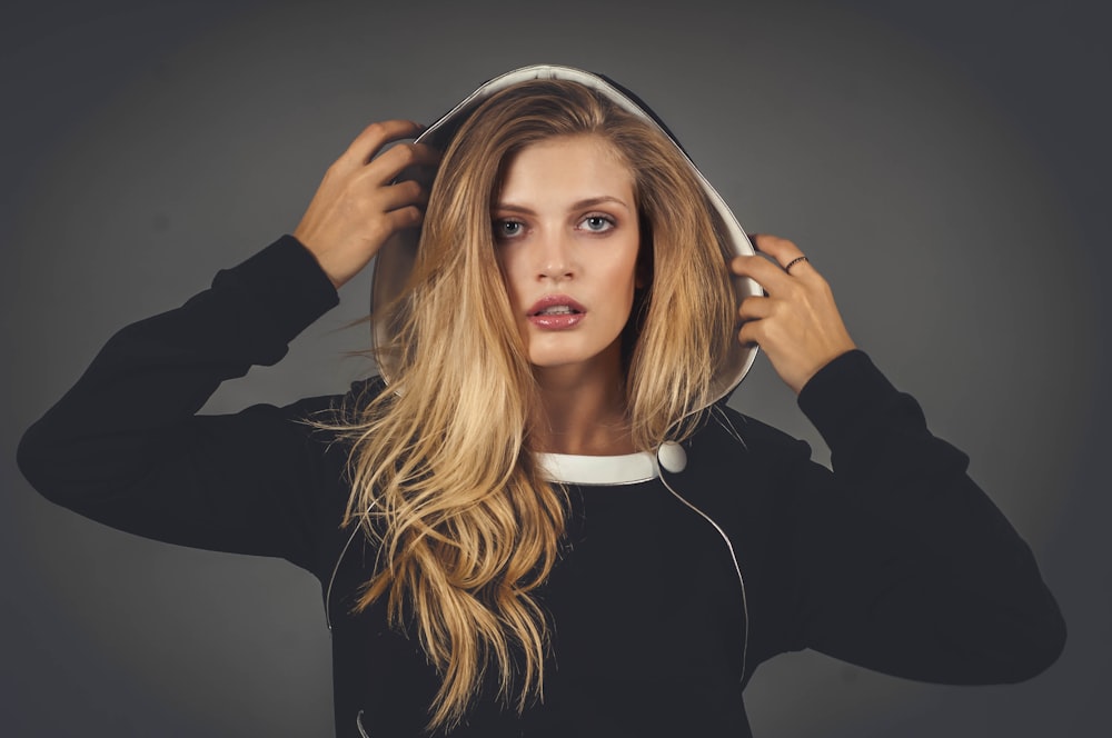 woman wearing black and white hoodie