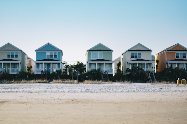 five assorted-color 2-storey houses