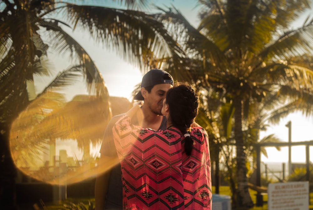 man and woman kissing