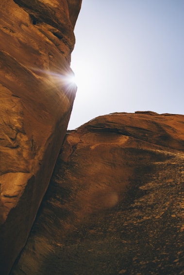 Sunlight filtering through red rock formations near the church grounds at Mountain View Baptist.