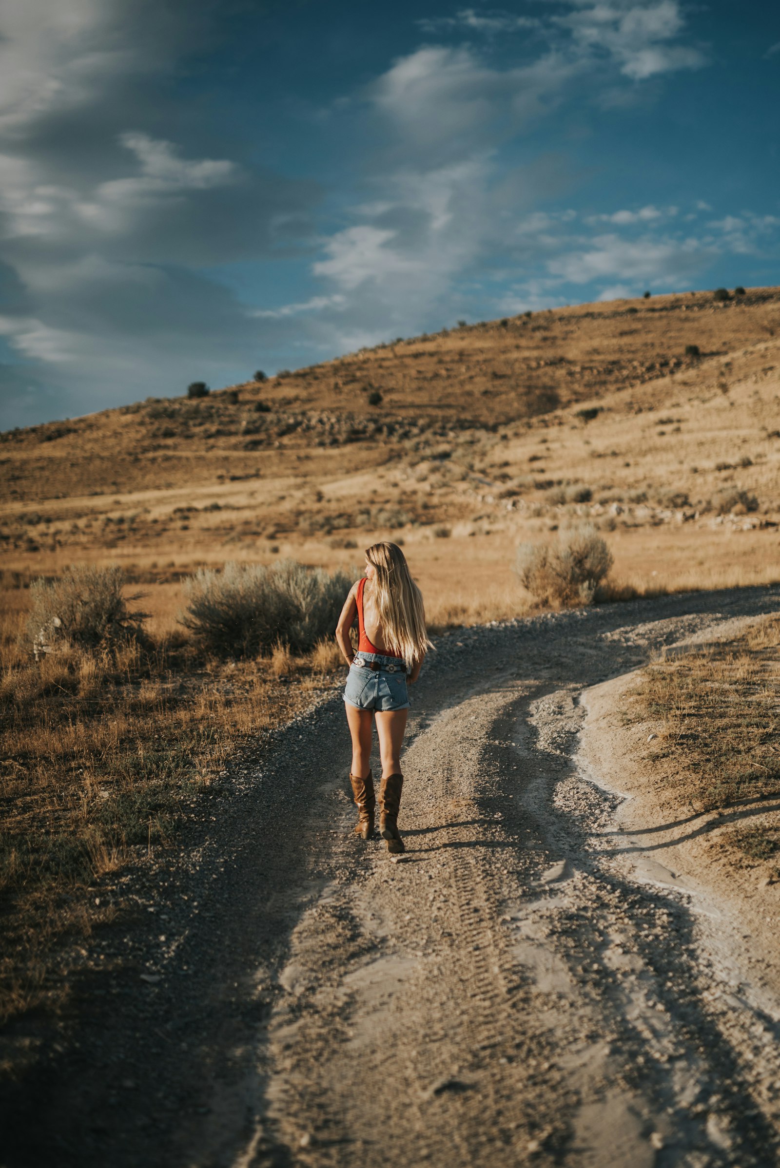 Sigma 50mm F1.4 DG HSM Art sample photo. Woman standing on dirt photography