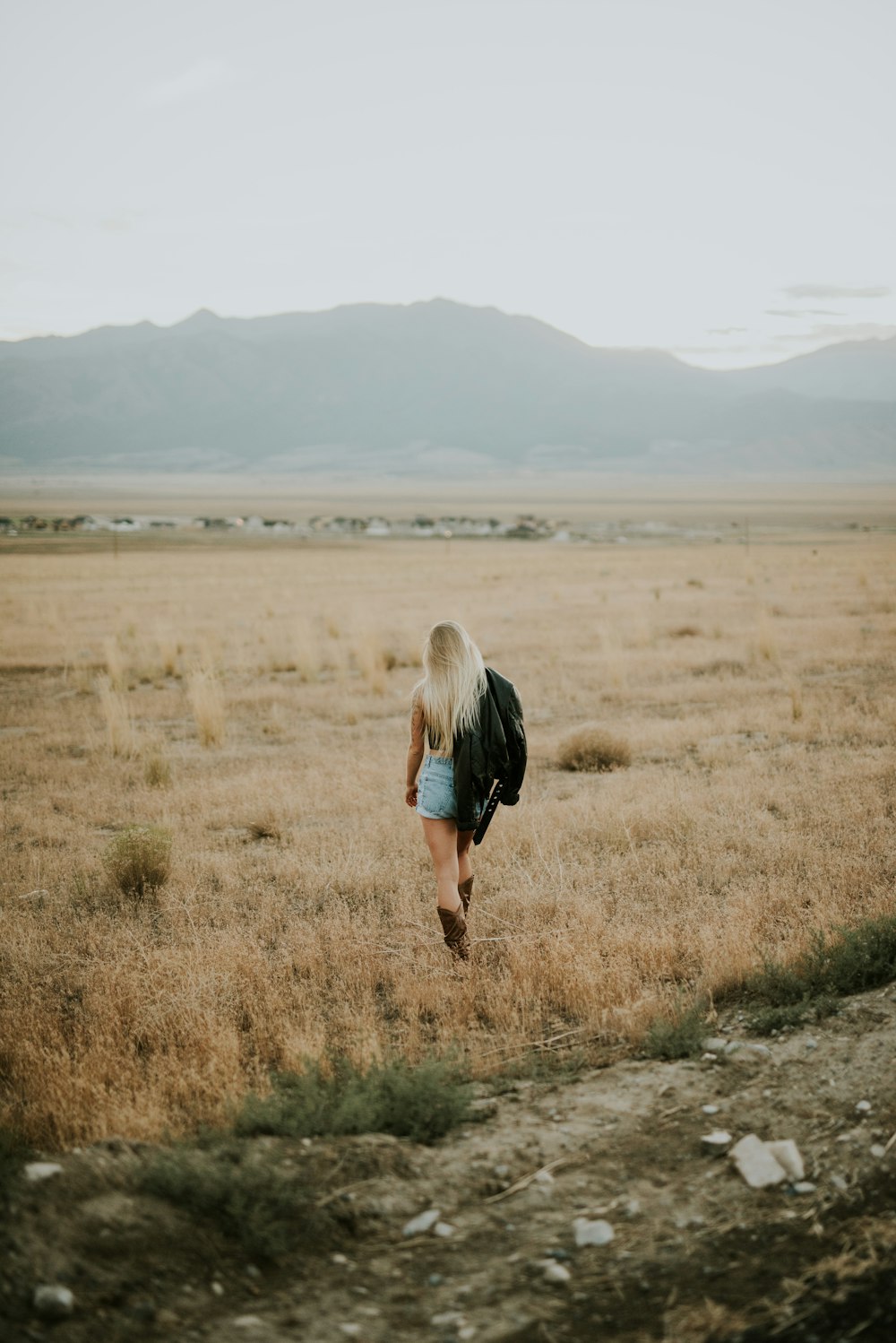 woman walking towards farm