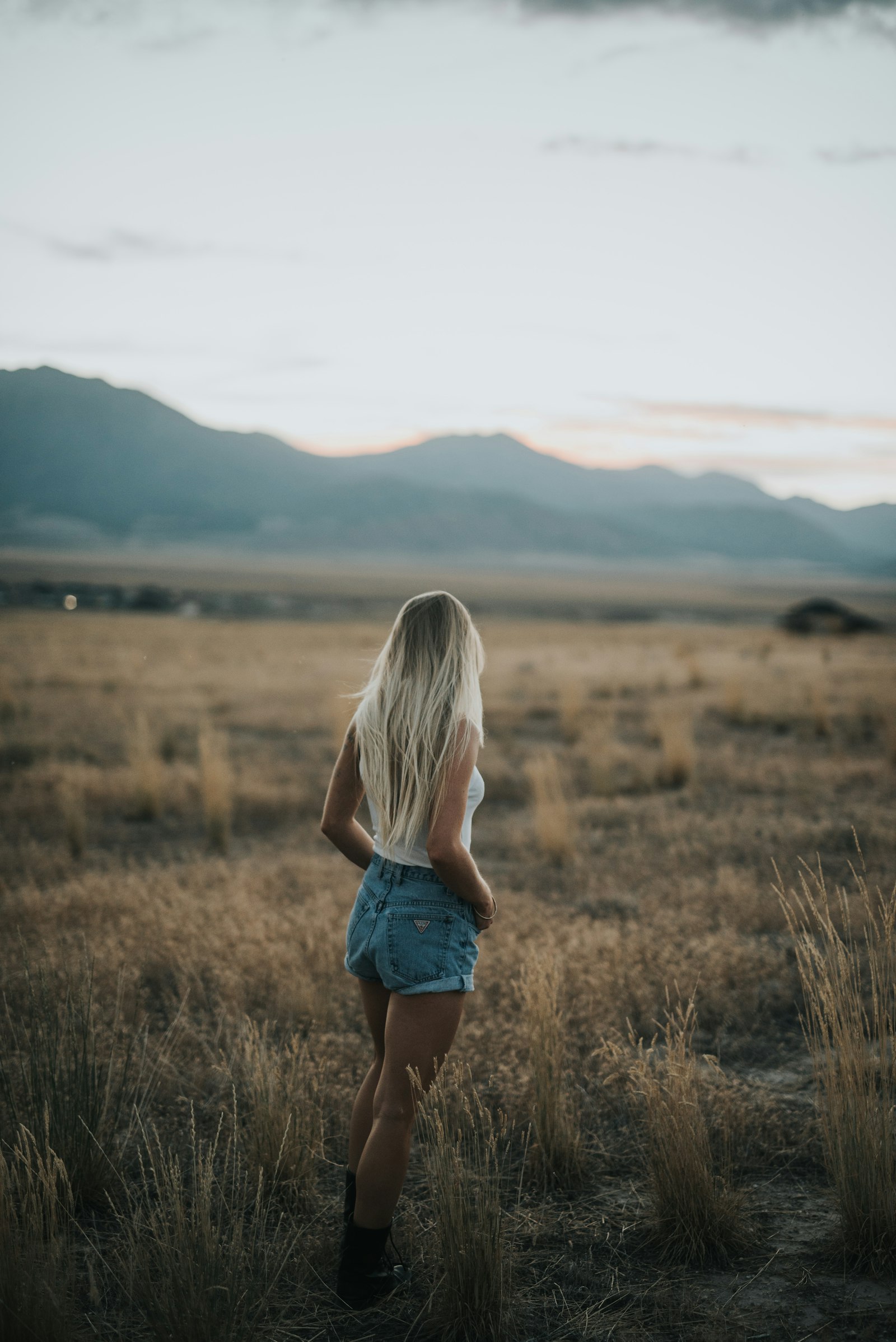 Sigma 50mm F1.4 DG HSM Art sample photo. Woman standing on field photography