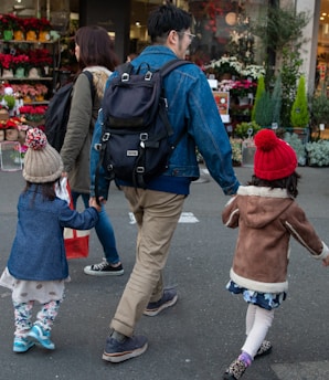 A parent and child packing backpacks together, preparing for a family European getaway