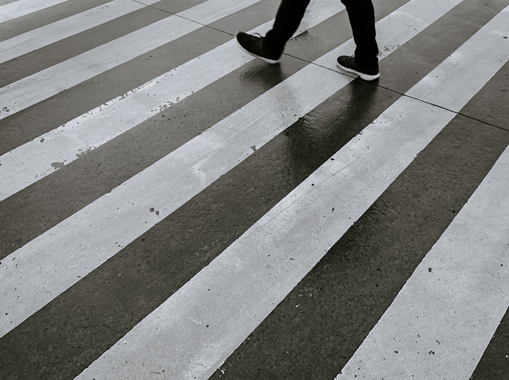 person walking on pedestrian lane during daytime