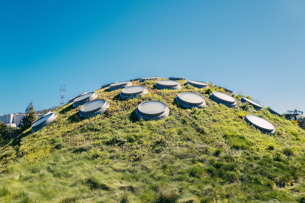 several round lids on hill