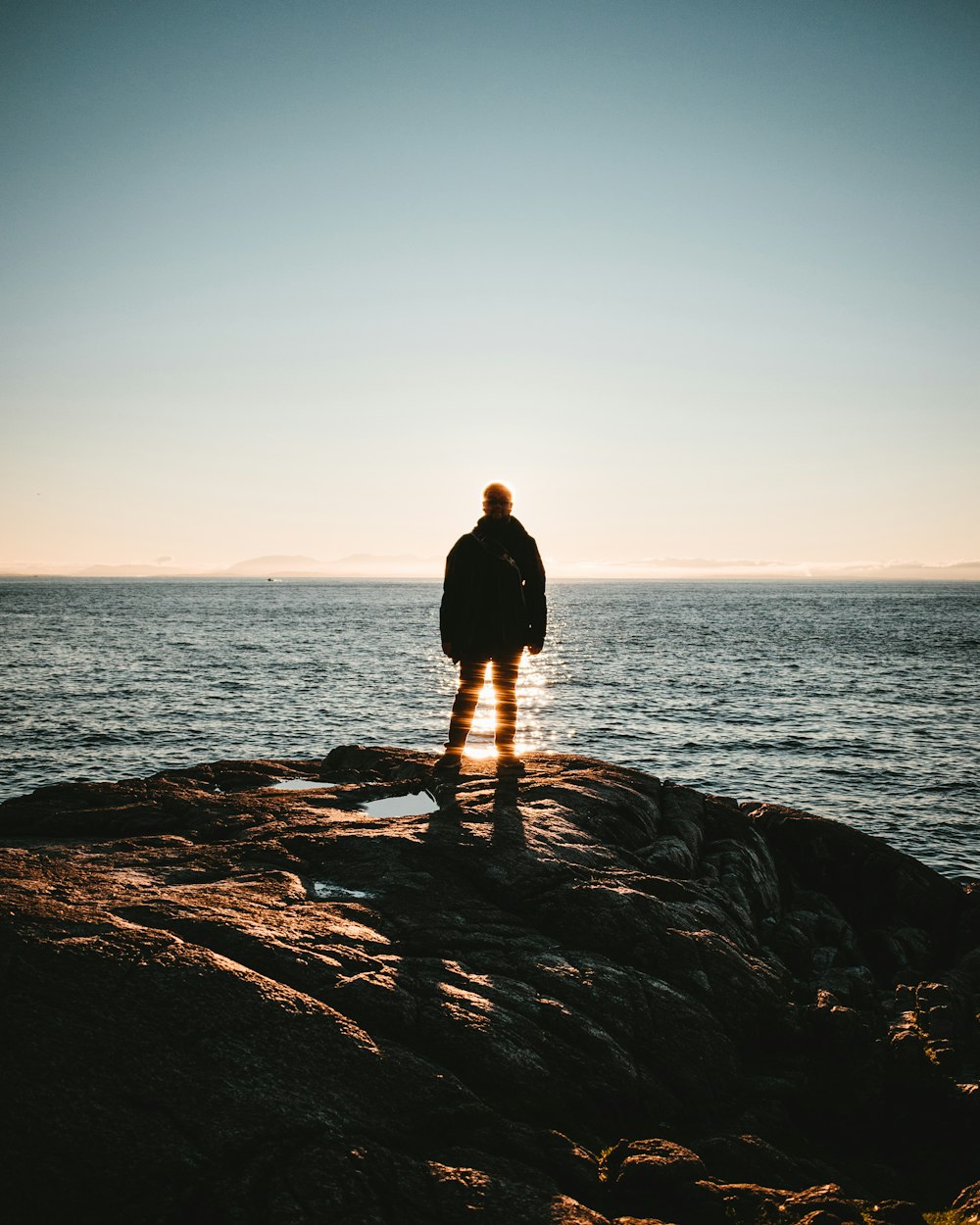 man standing on seacliff