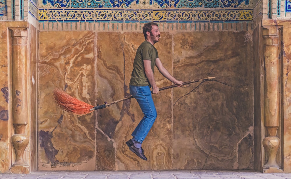 man riding on levitation broom painting