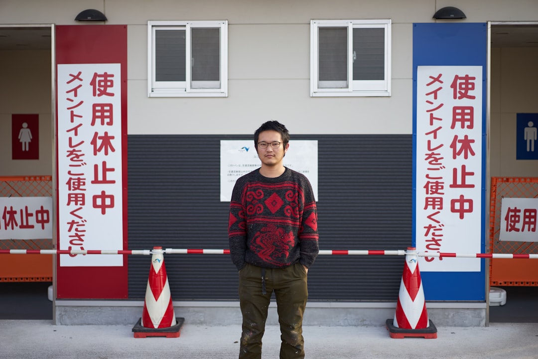 man wearing black and red crew-neck sweater