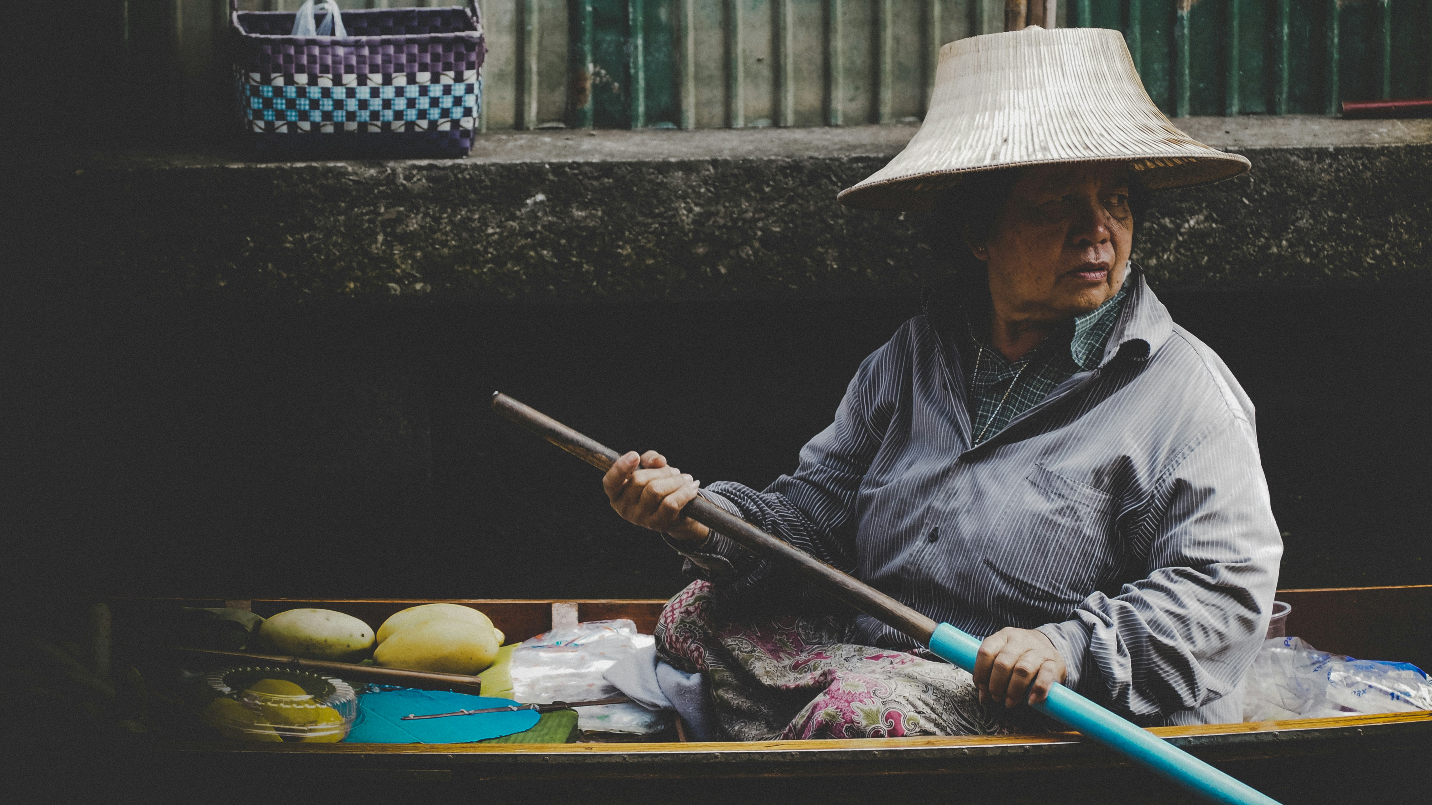 woman in wooden canoe