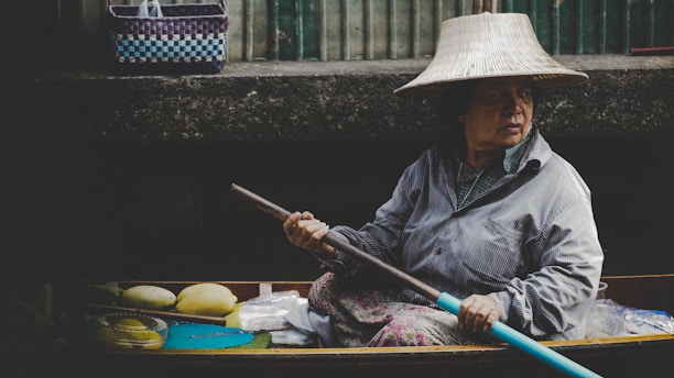 woman in wooden canoe