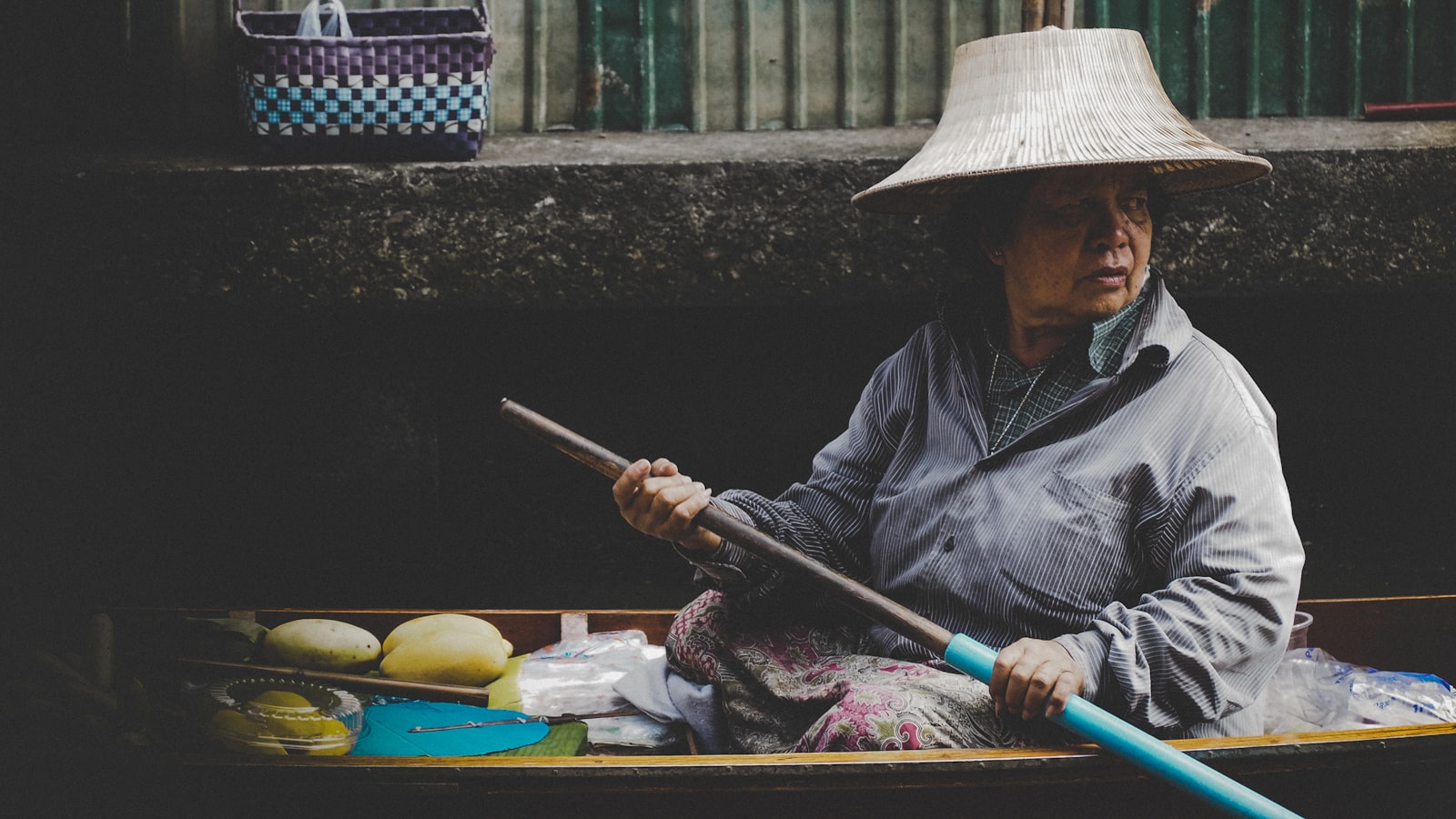 Olympus PEN E-PL8 sample photo. Woman in wooden canoe photography