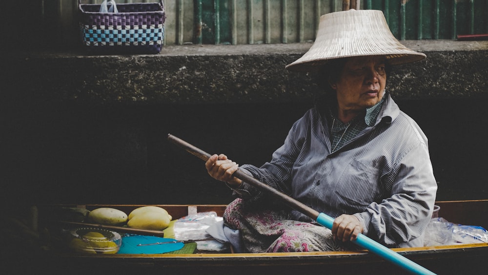 woman in wooden canoe