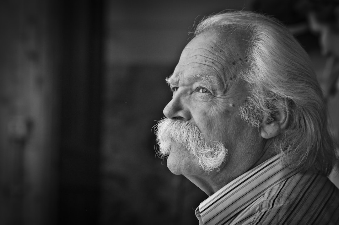 man in collared shirt grayscale photo