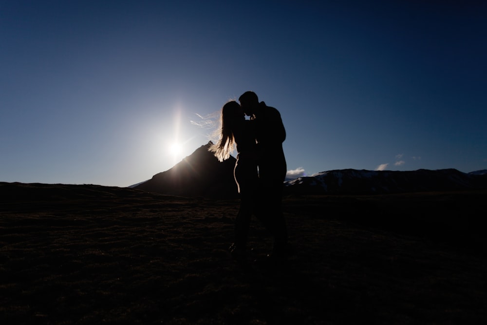 silhouette photography of man and woman