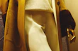 Close-up of a modern outfit featuring neutral tones and elegant textures displayed on a mannequin