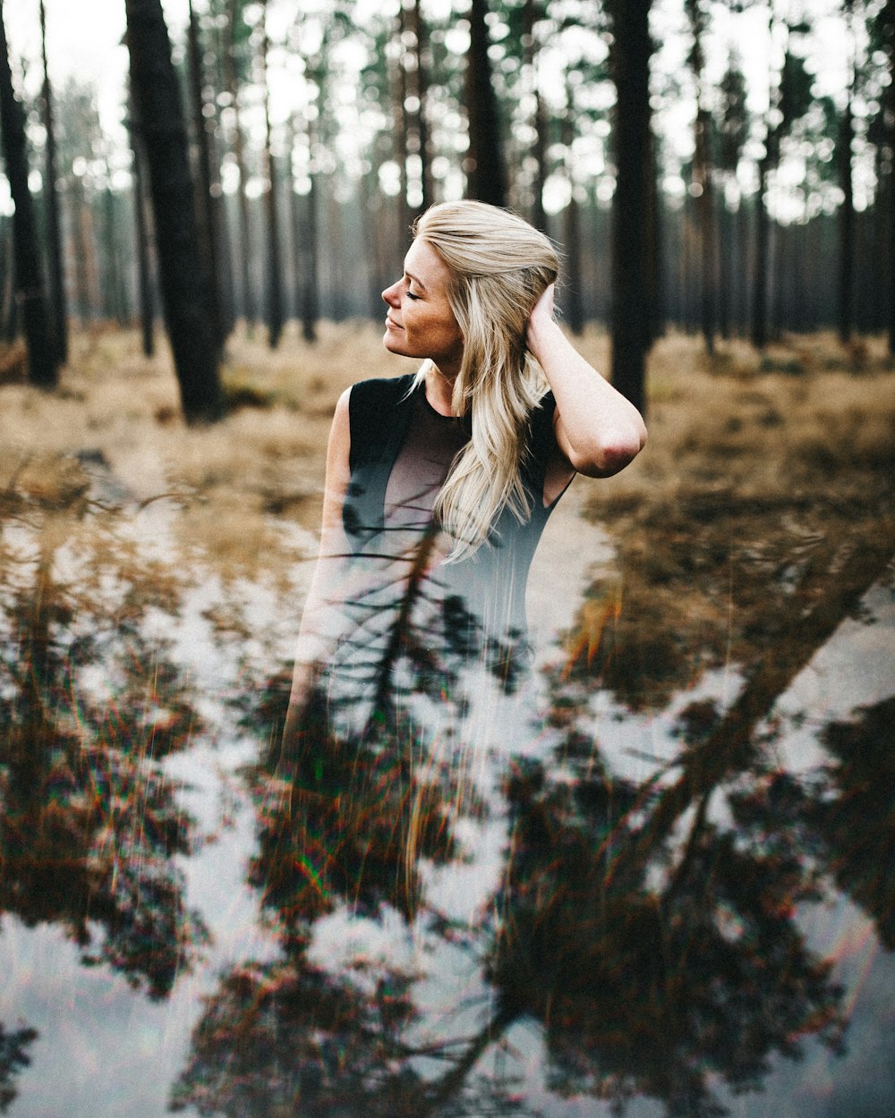 woman standing near woods