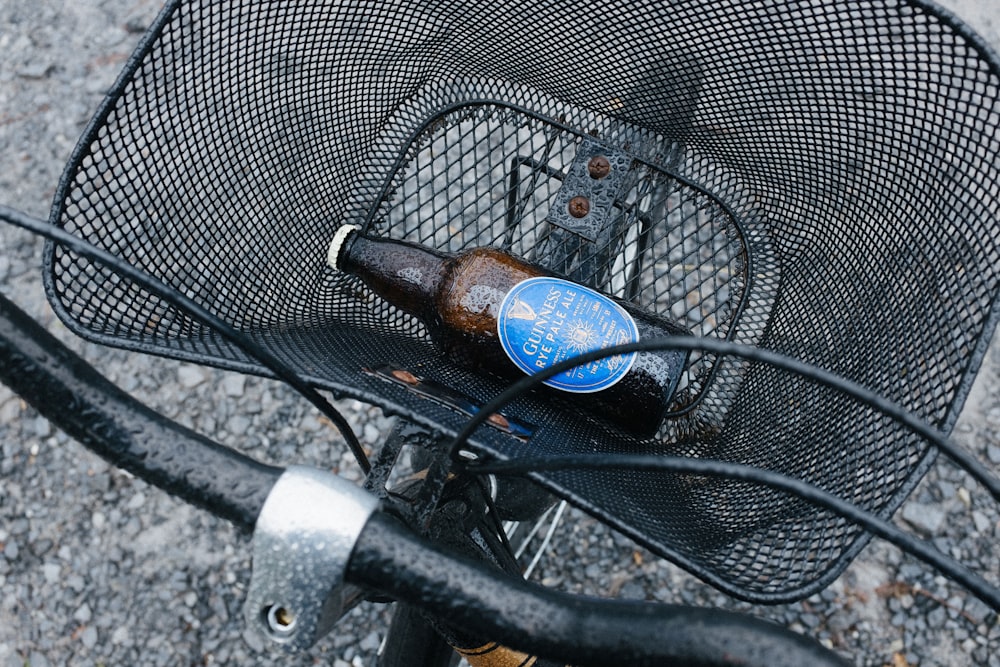 amber glass bottle on bicycle