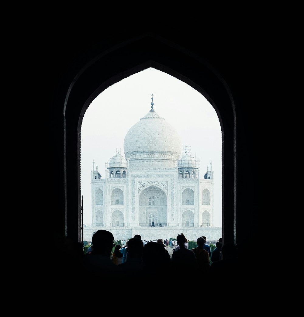 people next to dome building