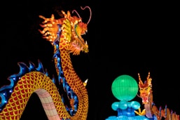 orange and blue lighted dragon statue