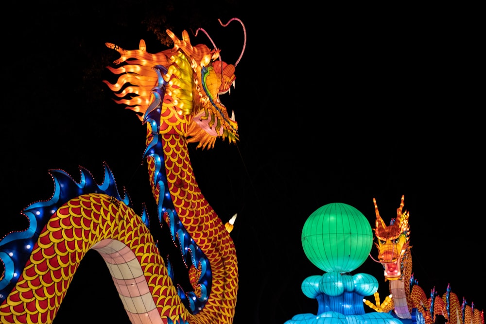 orange and blue lighted dragon statue