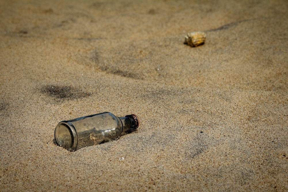 glass bottle on sand