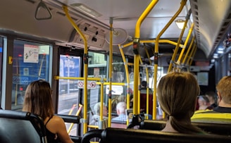 people sitting down inside vehicle