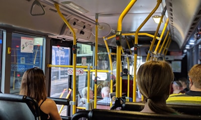 people sitting down inside vehicle